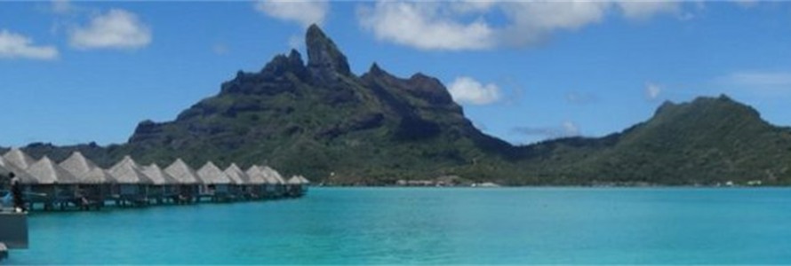 Overwater bunalows at the St. Regis, Bora Bora and Mount Otemanu.